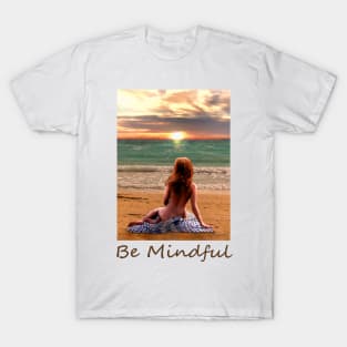 Woman girl seated on beach looking at sunset zen yoga buddhism T-Shirt